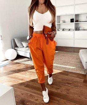 Літні легкі однотонні штани жіночі помаранчевого кольору фото — Beauty&Fashion