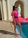 Суцільний купальник однотонний з чорними вставками на талії жіночий рожевого кольору 2561 фото 4 — Beauty&Fashion