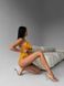 Суцільний купальник в рубчик однотонний з об'ємними воланчиками жіночий жовтого кольору 897 фото 6 — Beauty&Fashion