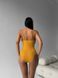 Суцільний купальник в рубчик однотонний з об'ємними воланчиками жіночий жовтого кольору 897 фото 7 — Beauty&Fashion