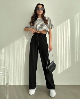 Літні легки однотонні штани вільного крою жіночі чорного кольору фото — Beauty&Fashion
