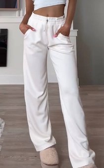 Стильные однотонные спортивные брюки свободного кроя женские молочного цвета фото — Beauty&Fashion