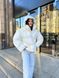 Тепла хутряна куртка з наповнювачем екопух жіноча молочного кольору S 50 фото 3 — Beauty&Fashion