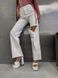 Однотонные джинсы свободного кроя с дыркой женские белого цвета 8885 фото 3 — Beauty&Fashion