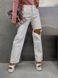 Однотонные джинсы свободного кроя с дыркой женские белого цвета 8885 фото 2 — Beauty&Fashion