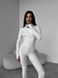 Однотонний теплий термо комбінезон жіночий білого кольору TE7 фото 2 — Beauty&Fashion