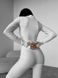 Однотонний теплий термо комбінезон жіночий білого кольору TE7 фото 7 — Beauty&Fashion